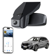 Car rearview mirror built-in dash cam with smartphone app control, 4K Ultra HD recording, GPS tracking, and BMW X1 Gen2 SUV models in the background.