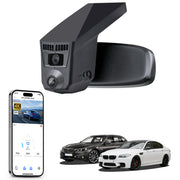 Car rearview mirror built-in dash cam with smartphone app control, 4K Ultra HD recording, GPS tracking, and BMW 5 Series Gen6 models in the background.