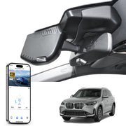 Car rearview mirror built-in dash cam with smartphone app control, 4K Ultra HD recording, GPS tracking, and BMW X1 Gen3 SUV models in the background.